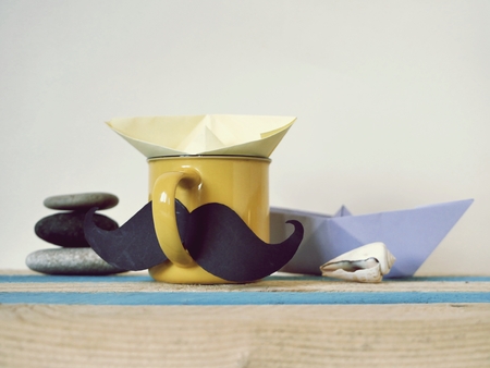 cup, mustache, toy boat, wooden table, Father's Dayの写真素材