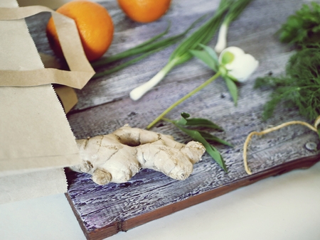 Vegetables, fruits, green herbs on the kitchen table, healthy food