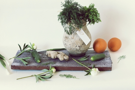 Vegetables, fruits, green herbs on the kitchen table, healthy foodの写真素材