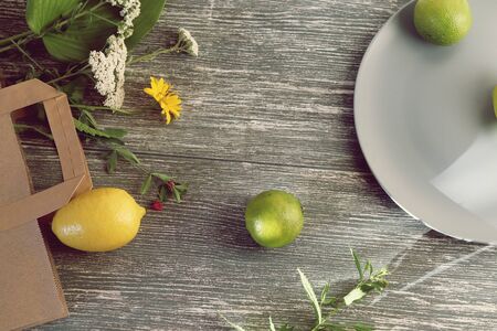 Limes, lemons, flowers from the packageの写真素材