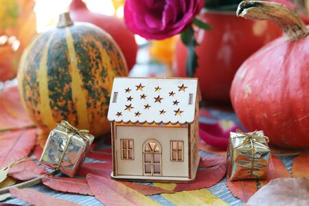 pumpkins, fresh roses, a toy house, leaves on the windowsill, Thanksgivingの写真素材