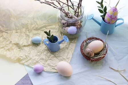 Easter decoration, eggs, pussy-willow branches surface on a window background