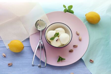 Natural ice cream, lemons on a wooden table, homemade dessert, healthy foodの写真素材