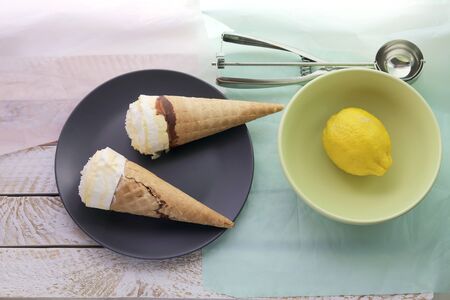 Natural ice cream, lemons on a wooden table, homemade dessert, healthy food