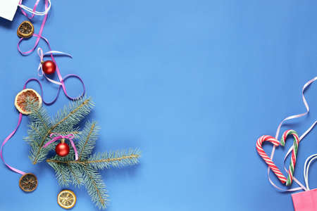 Merry Christmas, bright blue background with New Year's decor, caramel heart and space for an inscription, top viewの写真素材