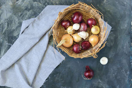 Fresh onions in a basket, top view, flatley, harvest concept, natural organic productsの写真素材