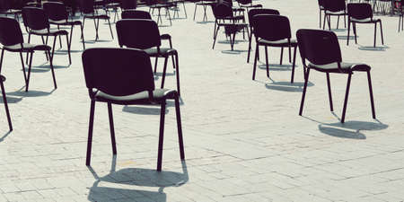 Chairs on the street are arranged in rows at a distance, keep your distance, quarantine measures,...