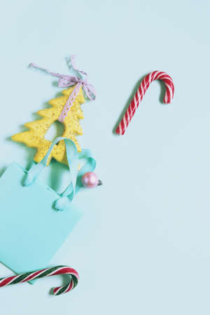 Merry Christmas, New Year's toys, fir branches on a light blue background, concept of congratulations, postcardの写真素材