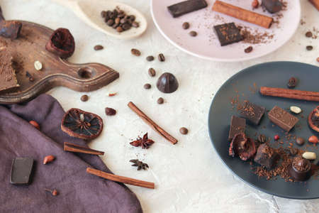 Chocolate, sweets and spices on linen fabric, top view, home cooking, sweet food