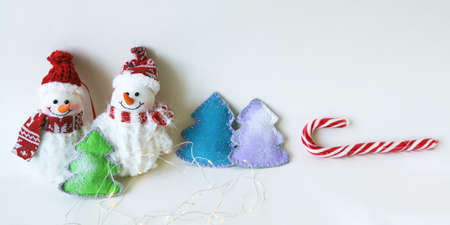 Christmas balls, snowman, tree on a light background, concept of congratulations, postcards, place...