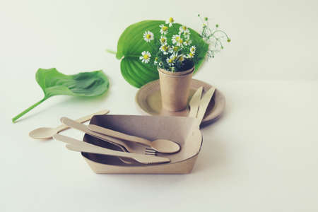 Environmentally friendly disposable tableware made from natural materials, a bouquet of field...