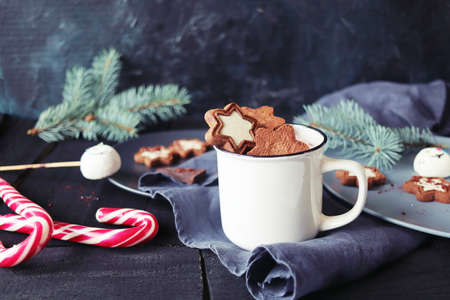 Christmas, New Year, a cup of coffee with meringues and marshmallows, caramel candies, a plate of...