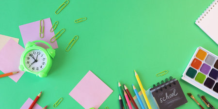 School supplies on green background with copy space. Back to school conceptの写真素材
