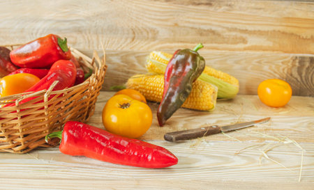 Fresh vegetables in a basket on a wooden background. Healthy food.の写真素材