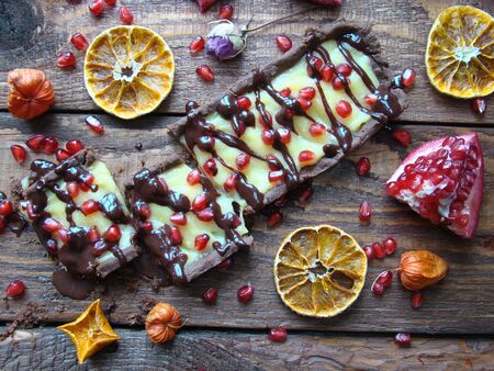 chocolate tart with lemon curd and pomegranateの写真素材