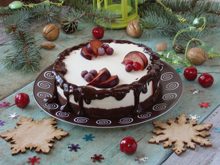 cheesecake with chocolate and lemon, and pomegranate seedsの写真素材