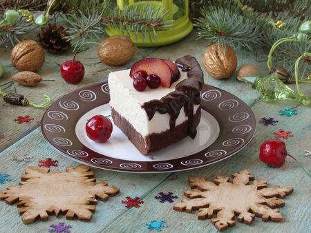 cheesecake with chocolate and lemon, and pomegranate seedsの写真素材