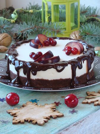 cheesecake with chocolate and lemon, and pomegranate seedsの写真素材
