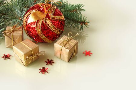 Christmas decorations on mirror white background  with giftsの写真素材