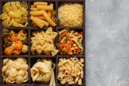 Pasta brown square wooden box on white backgroundの写真素材