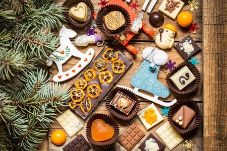 chocolate sweets with Christmas symbols, toys, tree