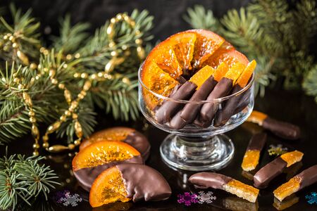 Chocolate candy, citrus fruit, dessert, oranges with Christmas symbolsの写真素材