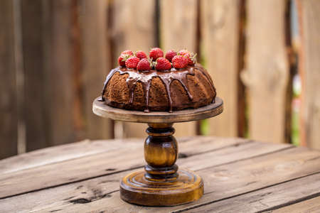 chocolate cake with fresh strawberries and chocolate icing summer mood