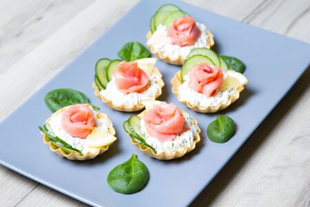 Tartlet with cream cheese, cucumber and slightly salted troutの写真素材