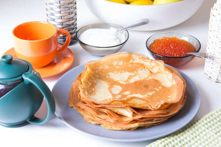 Traditional Russian pancakes with caviar and sour cream. Shrovetide. Selective focusの写真素材