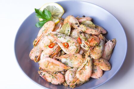 Shrimps fried with garlic and chili. Close-up, selective focus.の写真素材