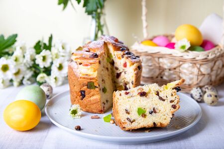 Craffin (Cruffin) with raisins and candied fruits. Easter Bread Kulich and painted eggs. Easter...