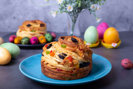 Craffin (Cruffin) with raisins, nuts and candied fruits. Easter Bread Kulich and painted eggs....