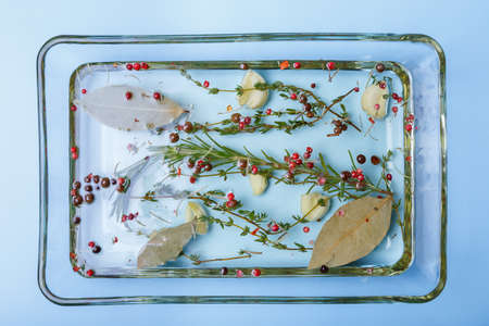 Olive oil with herbs and spices. Step by step. Close-up.の写真素材