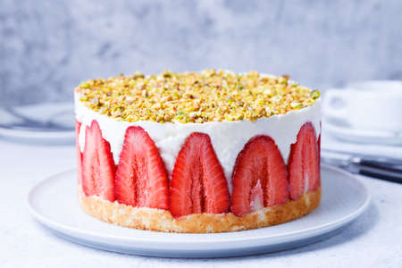 Freesier cake with fresh strawberries and pistachios. French classic dessert. Close-up.の写真素材