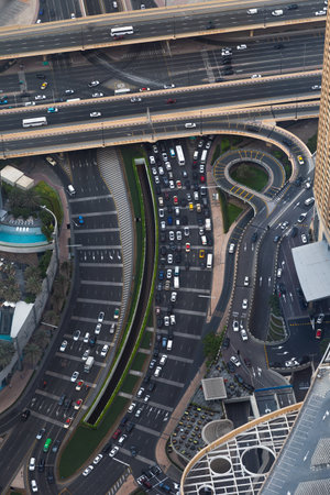 DUBAI, UAE (UNITED ARAB EMIRATES) - JULY 19, 2022: Panoramic and aerial view of Dubai city from the world's tallest building Burj Khalifa. View of skyscrapers and roads.のeditorial素材