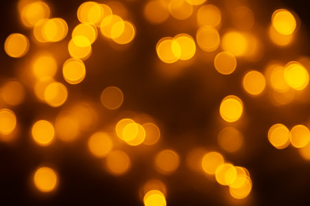 Abstract background, orange bokeh on a black background.の写真素材