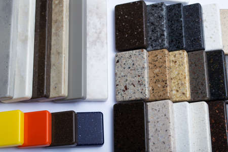Samples of natural granite, marble and quartz stone, countertops. Model from stones, close-up....