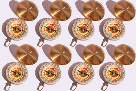 compass on white background close-up with hard shadows with copy space. Pattern on white backgroundの写真素材