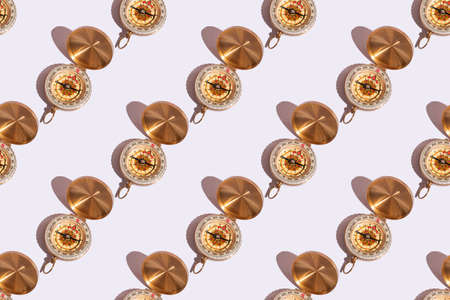 compass on white background close-up with hard shadows with copy space. Pattern on white backgroundの写真素材