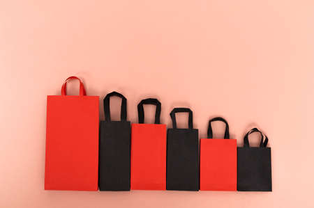 Black friday concept, mockup of paper black and red packages on colored background. Black Friday saleの写真素材