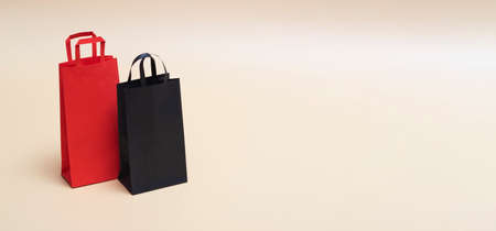 Black friday concept, mockup of paper black and red packages on colored background. Black Friday. With copy space. Bannerの写真素材