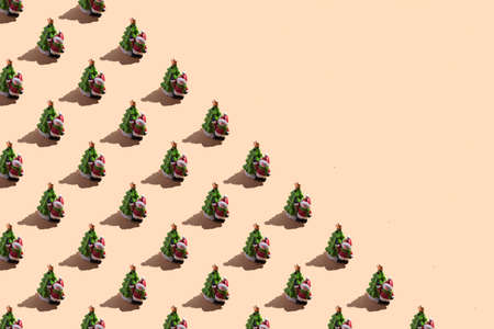 New Year's card close-up: a snowman with a Christmas tree on a beige background with a hard shadow. Top view with copy space seamless pattern, bannerの写真素材