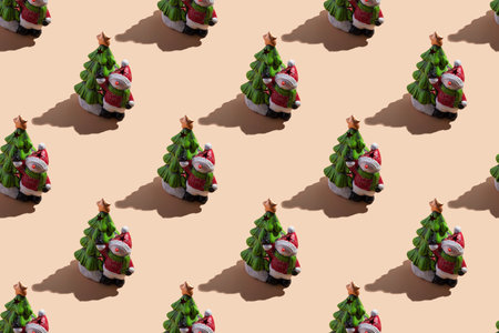 New Year's card close-up: a snowman with a Christmas tree on a beige background with a hard shadow. Top view, seamless patternの写真素材