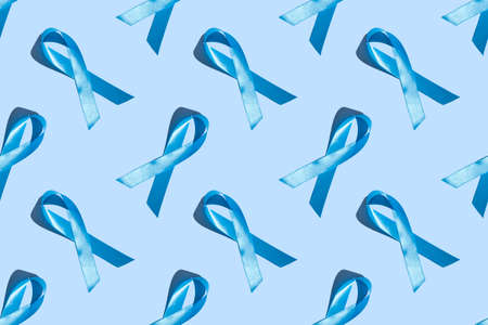 Concept for world diabetes day 14 november. Symbolic color bow to raise awareness on the day of diabetes on a light background. Seamless pattern. Bannerの写真素材