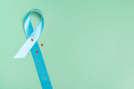 Concept for world diabetes day 14 november. Symbolic bow color raising awareness on diabetes day on light background.の写真素材