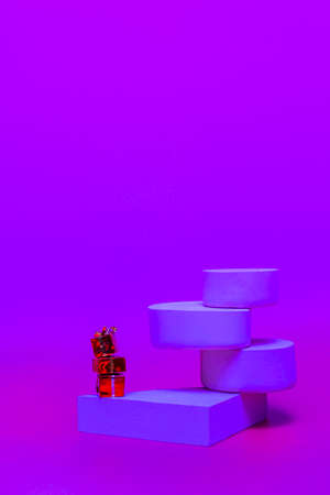 Monochrome platform on a bright pink background. Stylish podium in geometric style for product presentation. Minimalistic style. Verticalの写真素材