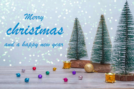 Winter background with Christmas trees in sparkles with Christmas decor. With copy space. Merry christmas and a happy new year. Happy Holidays.の写真素材