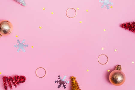 Flat christmas mockup with new year decor on pink background with copy spaceの写真素材