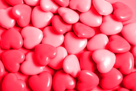 Composition for Valentine's Day on February 14. Pink background and colorful hearts, seamless...
