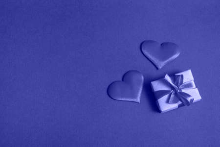 Composition for Valentine's Day. On a very peri background, red hearts close up with copy spaceの写真素材